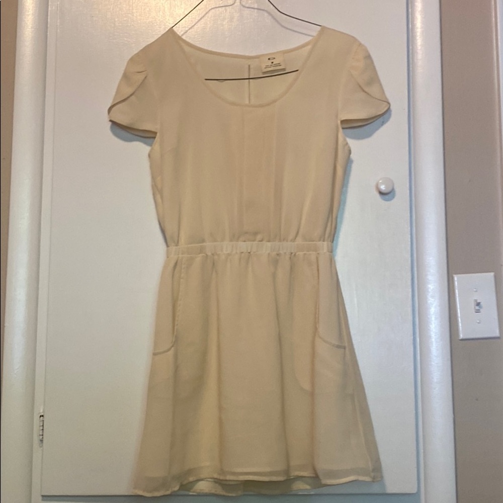 Mini cream “pins and needles” dress